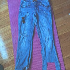 VINTAGE DISTRESSED JEAN. keith harring detail. distressed bottom.distressed knee